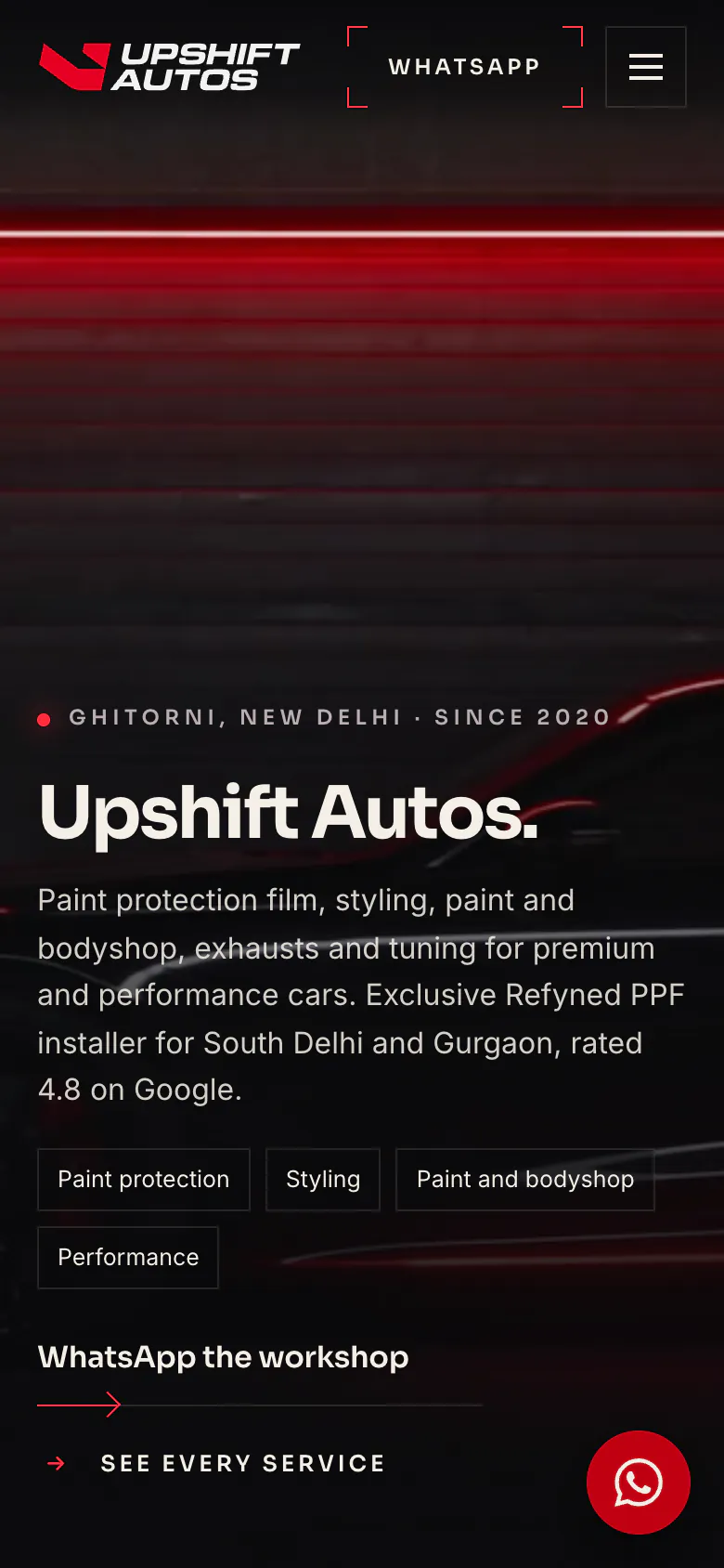 The upshiftautosindia.com homepage on a phone, with the same hero, services and WhatsApp button.